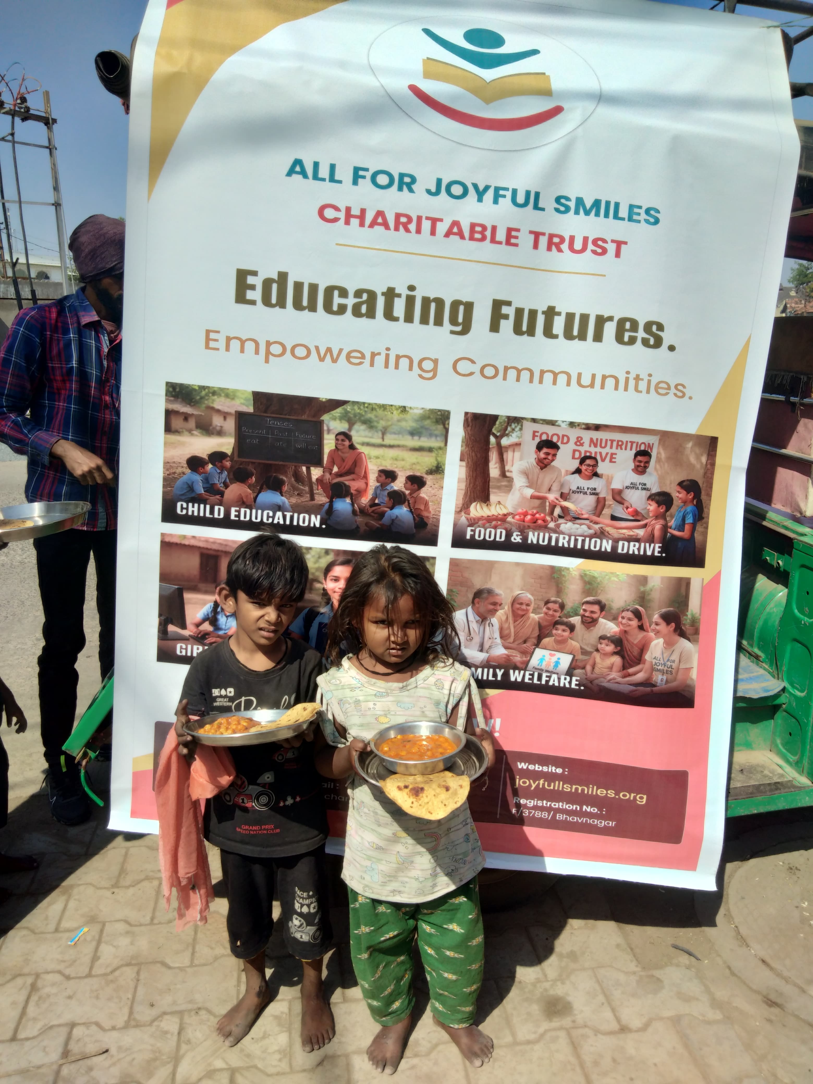 Two small children receiving food support